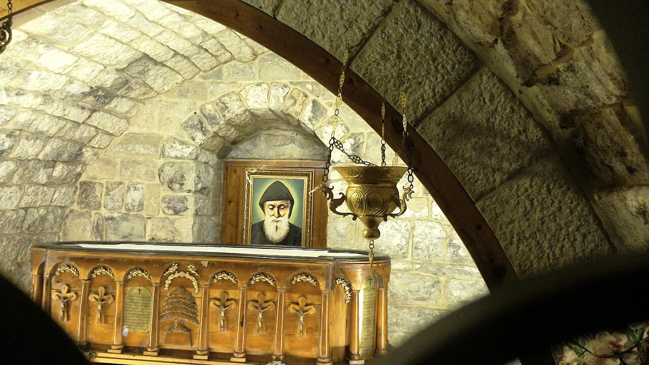 The tomb of Saint Charbel in the monastery church at Annaya, with his portrait and a vigil lamp
