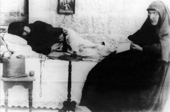 Photograph of St Rafqa, ill and being cared for at the monastery